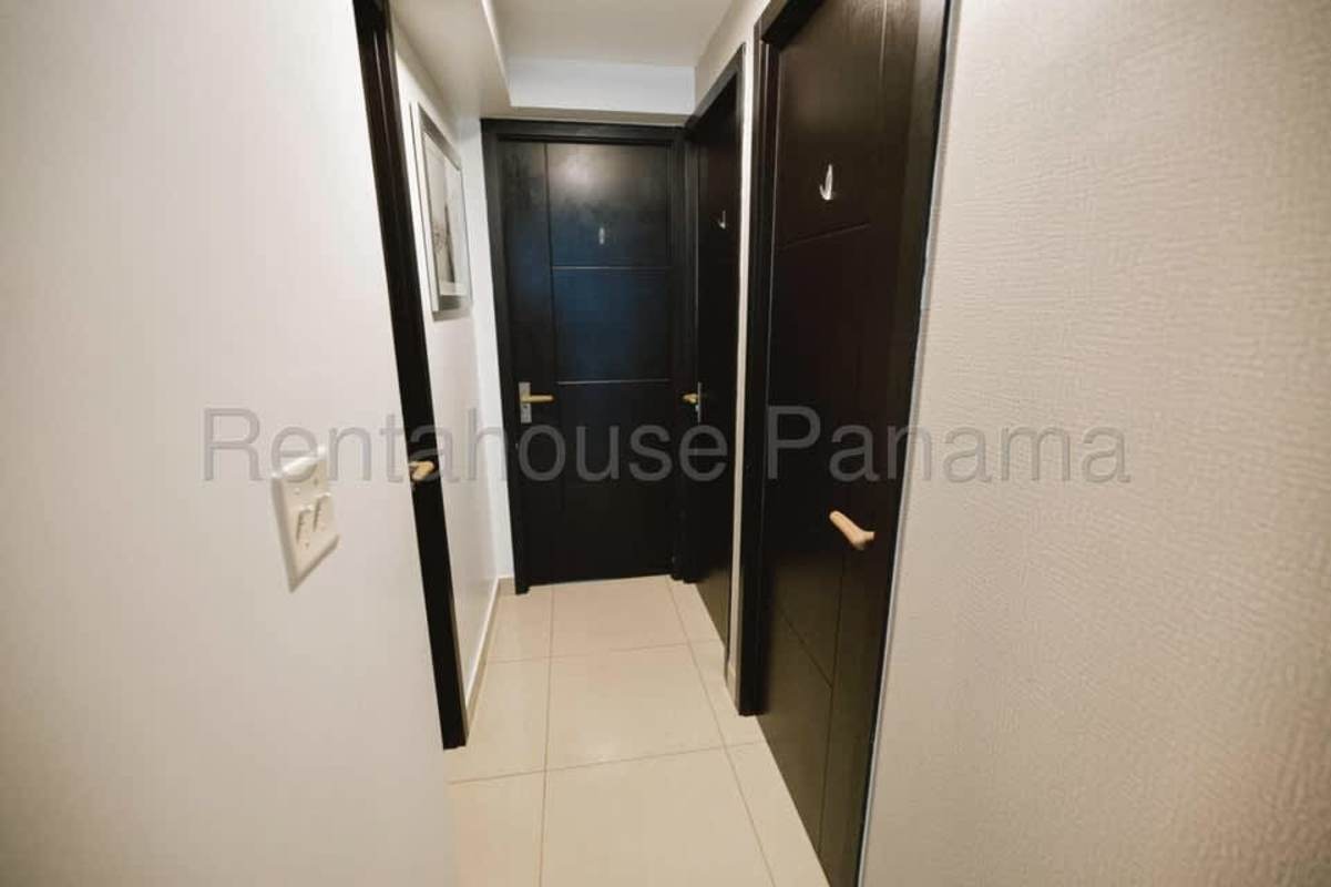 Apartment interior hallway with dark doors Coral Tower Carrasquilla Panama