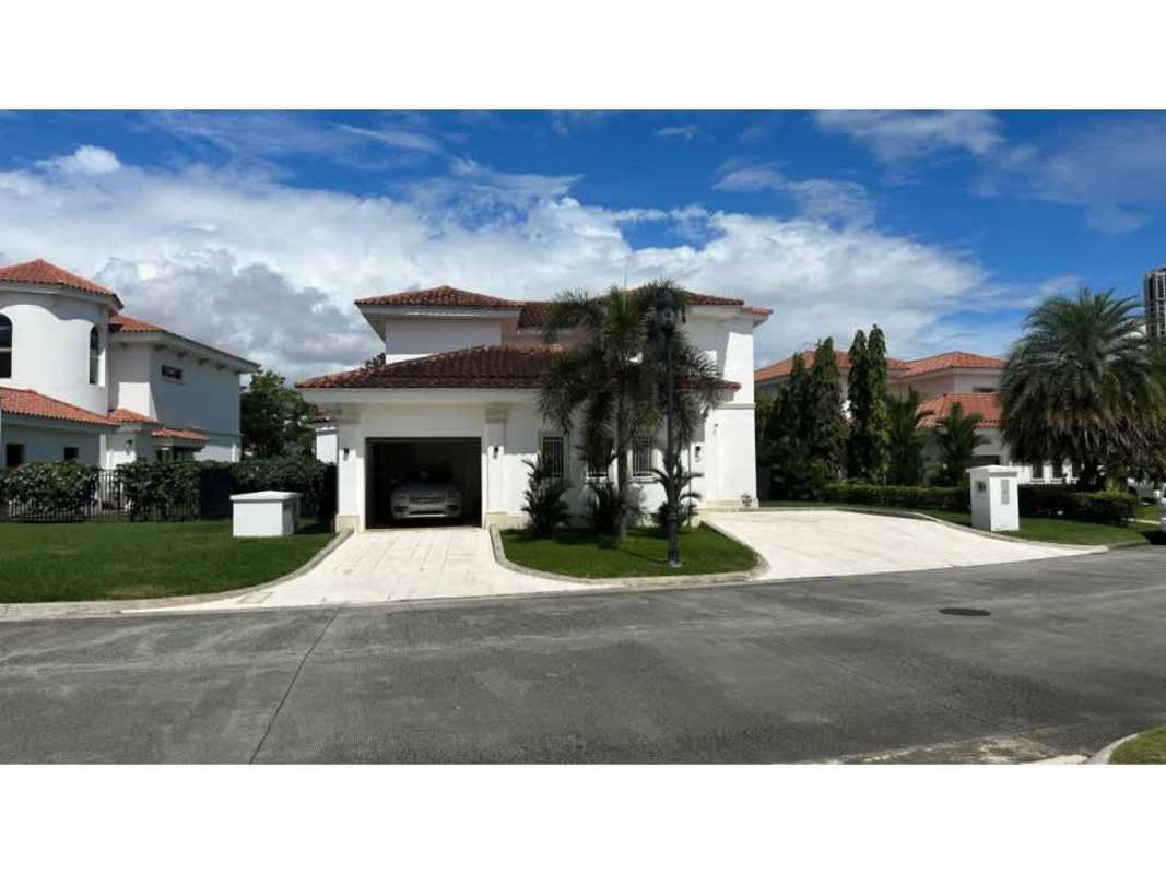 Two-story luxury house with red tile roof and palm landscaping in Santa Maria Panama