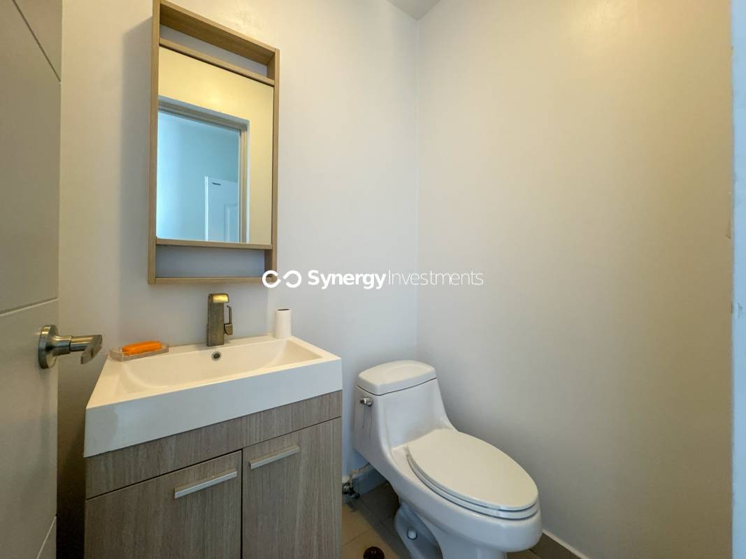 Master bedroom with large window and ocean view at PH Pacific Sea Panama