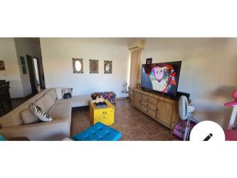 Comfortable living room sectional sofa flat-screen TV family space Villa Brisas de Lajas Panama