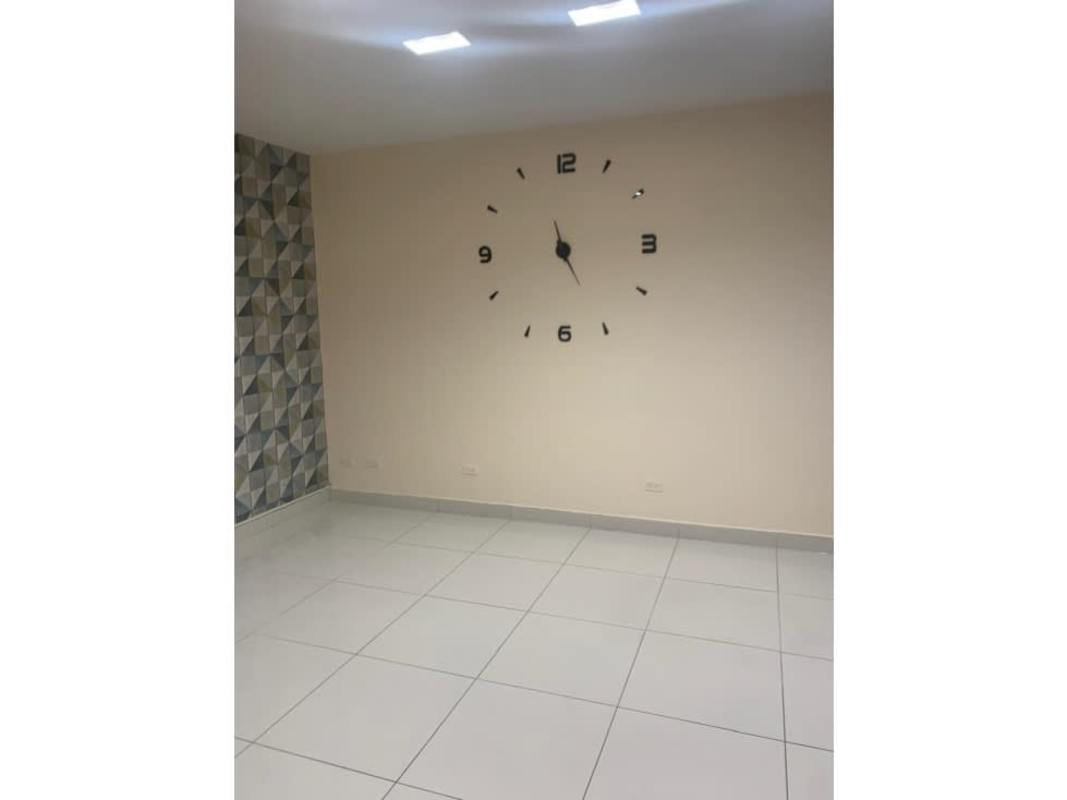 Commercial office interior with geometric accent wall design and tile flooring in PH Top Tower Costa del Este