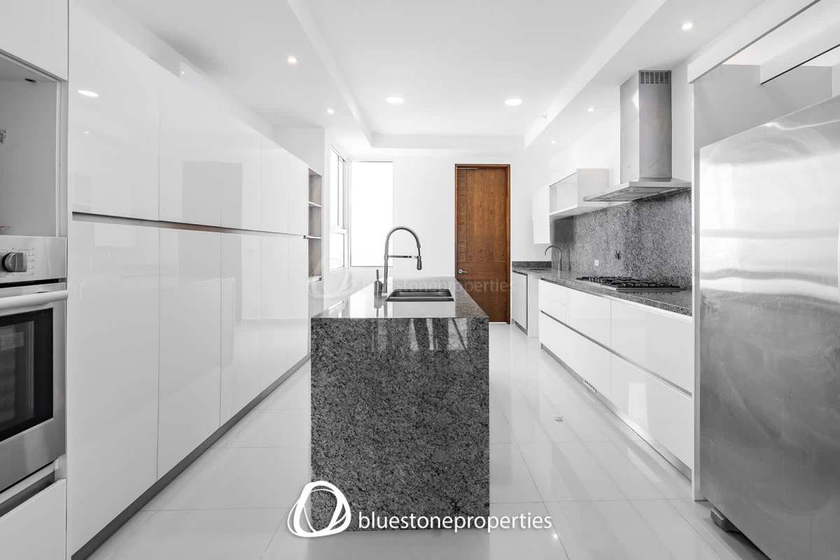 Spacious master bedroom with floor-to-ceiling windows overlooking Costa del Este and ocean in PH Paramount Panama