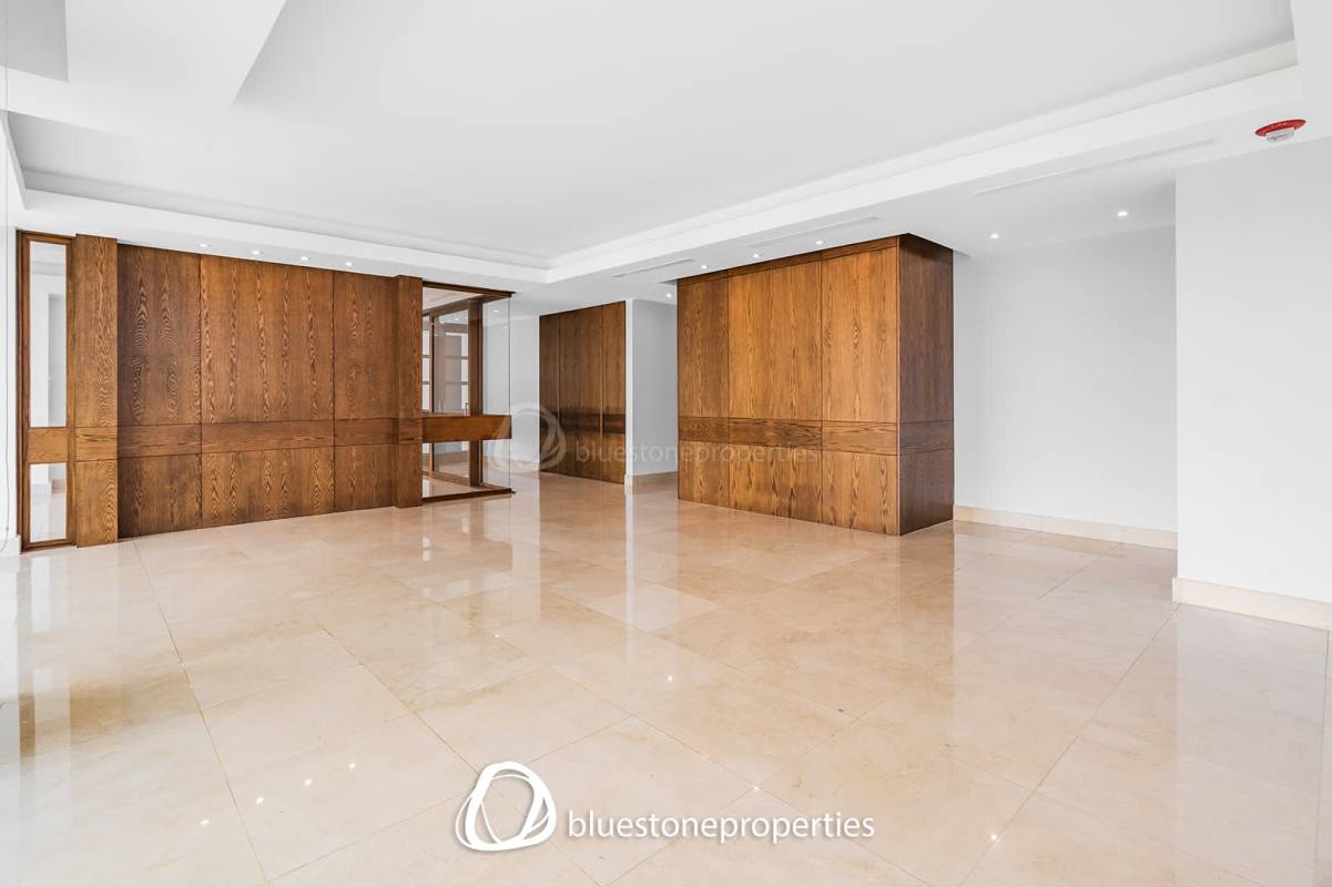 Spacious kitchen with granite island, stainless steel appliances and white cabinets in PH Paramount Costa del Este Panama