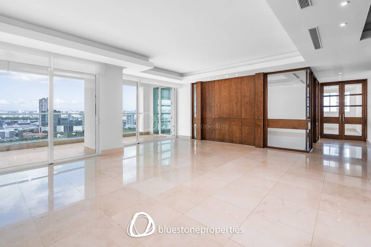 Modern living room with marble floors, floor-to-ceiling windows and skyline views in PH Paramount Costa del Este