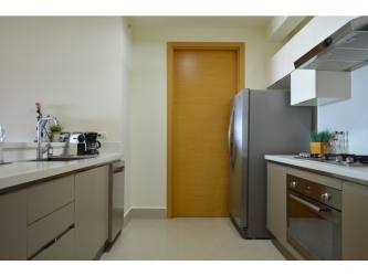 Bright kitchen with stainless steel appliances and modern cabinetry in Casamar PH Perlamar Panama