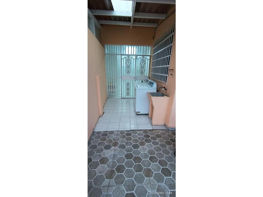 Laundry room utility sink washer hookup ceramic tile Villa de Vizcaya Panama