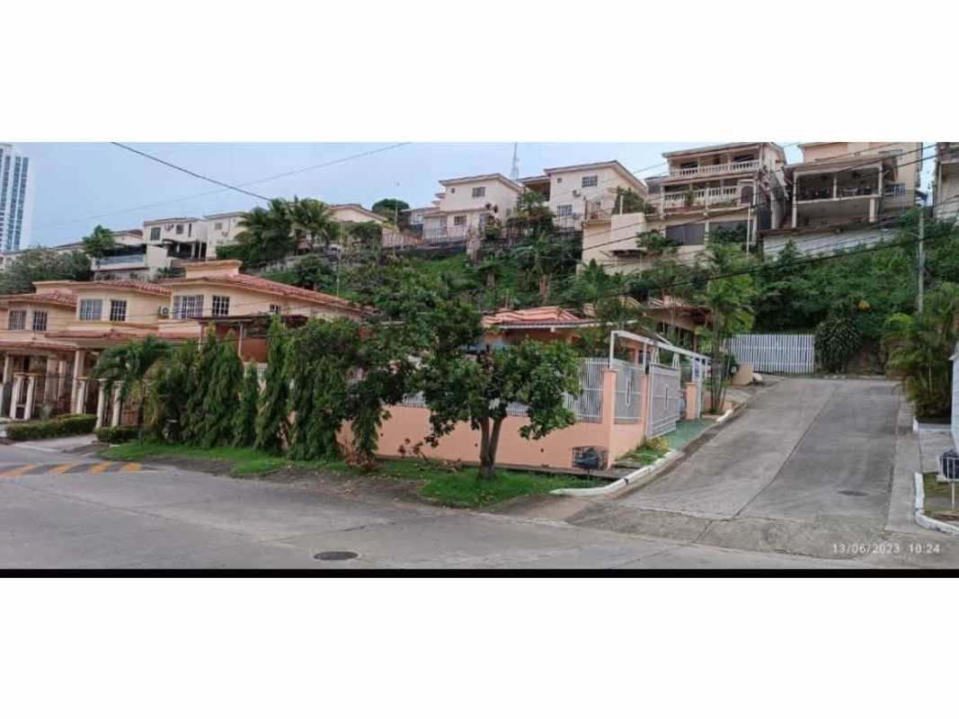 Community hillside homes terracotta roofs tropical gardens Villa de Vizcaya Panama City