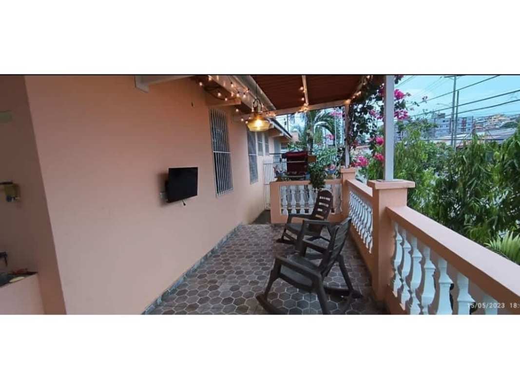 Large covered terrace with outdoor seating string lights Villa de Vizcaya Panama