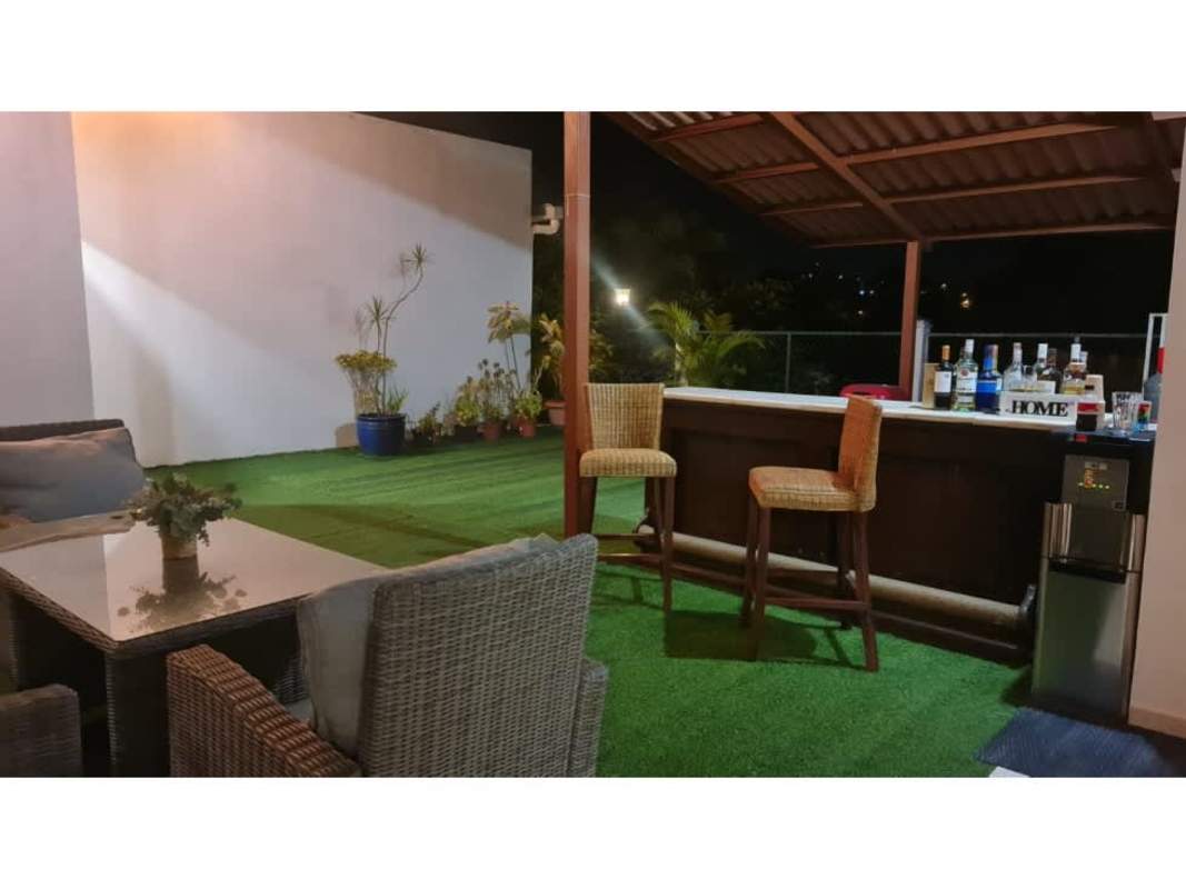 Kitchen with glossy red cabinets, granite counters villa zaita panama