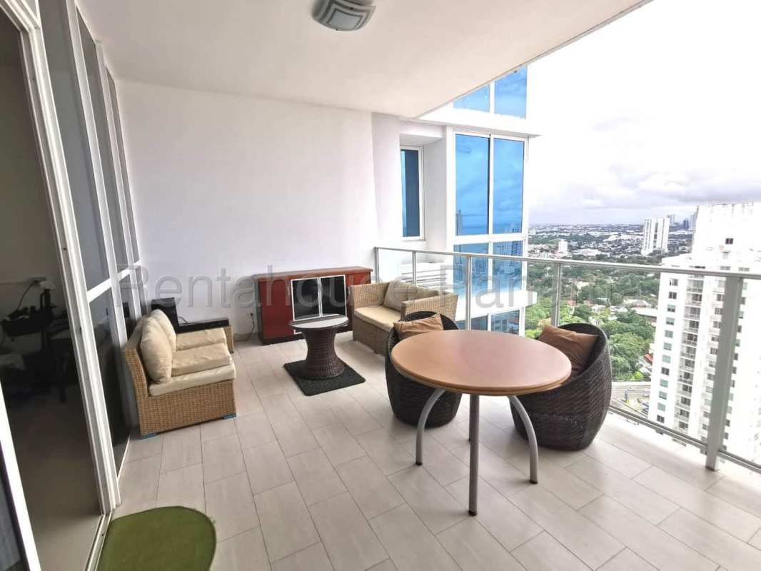 Bedroom with large windows city skyline view modern furnishings at PH Quadrat Panama