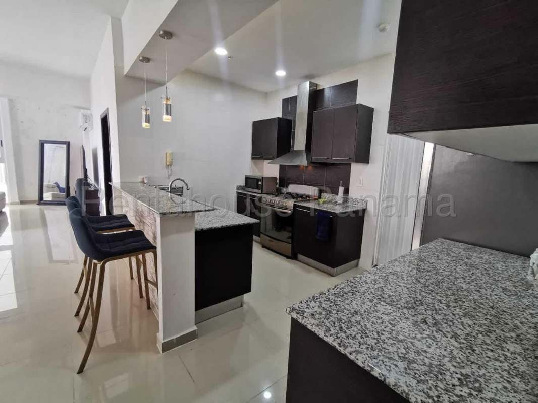 Furnished living area with modern furniture and balcony in PH Quadrat Panama