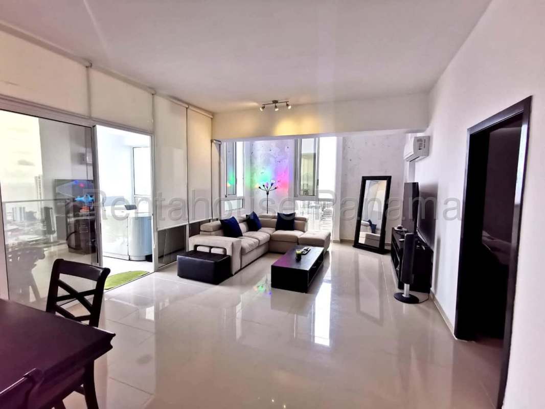 Contemporary open living room with balcony access at PH Quadrat in Panama City