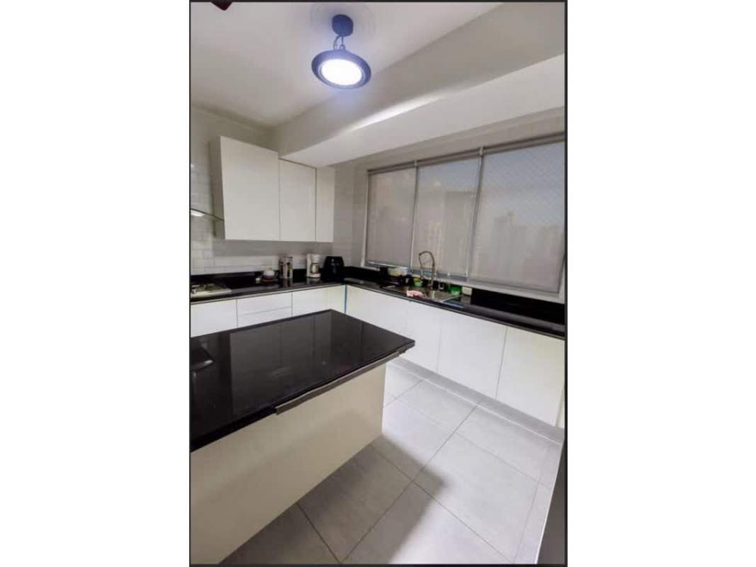 Furnished kitchen with granite countertops and appliances at PH Jade Tower San Francisco Panama City