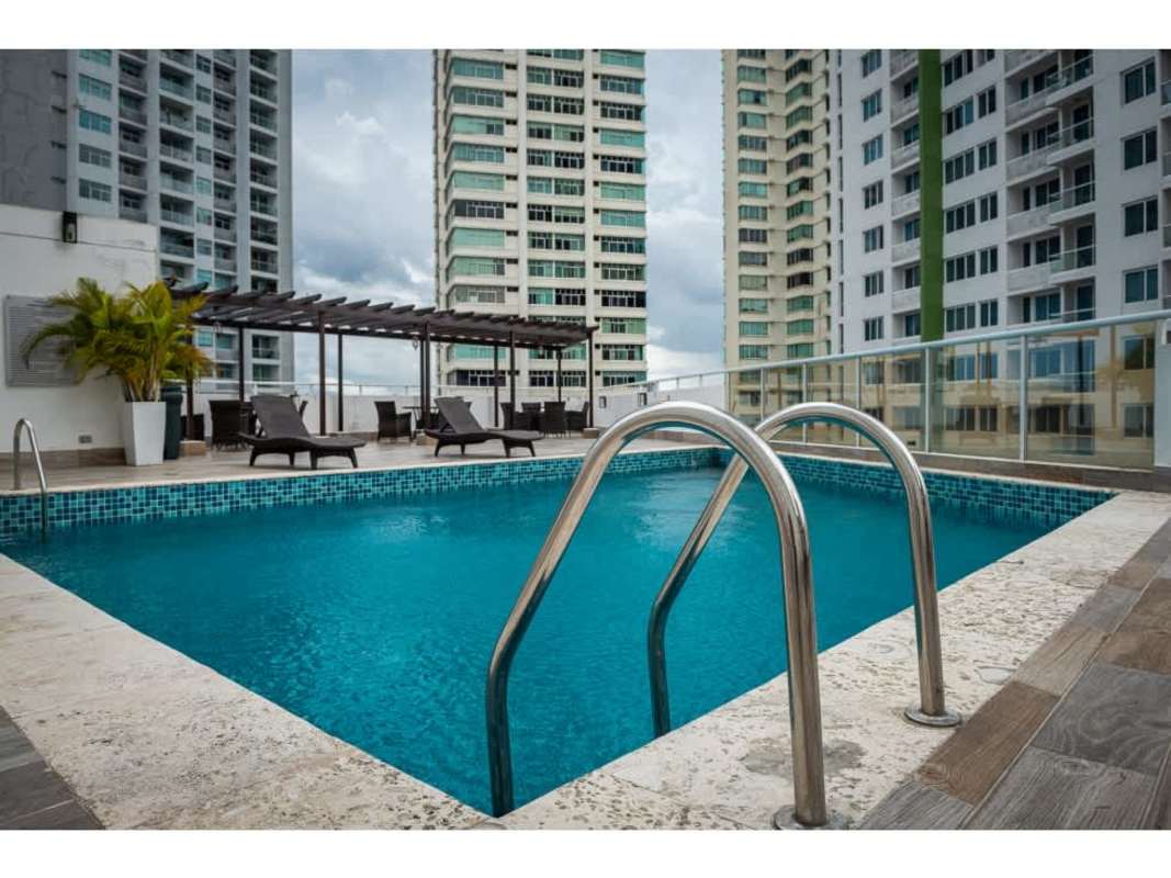 Spacious living room with large windows and balcony access at PH El Mare 700 Panama City