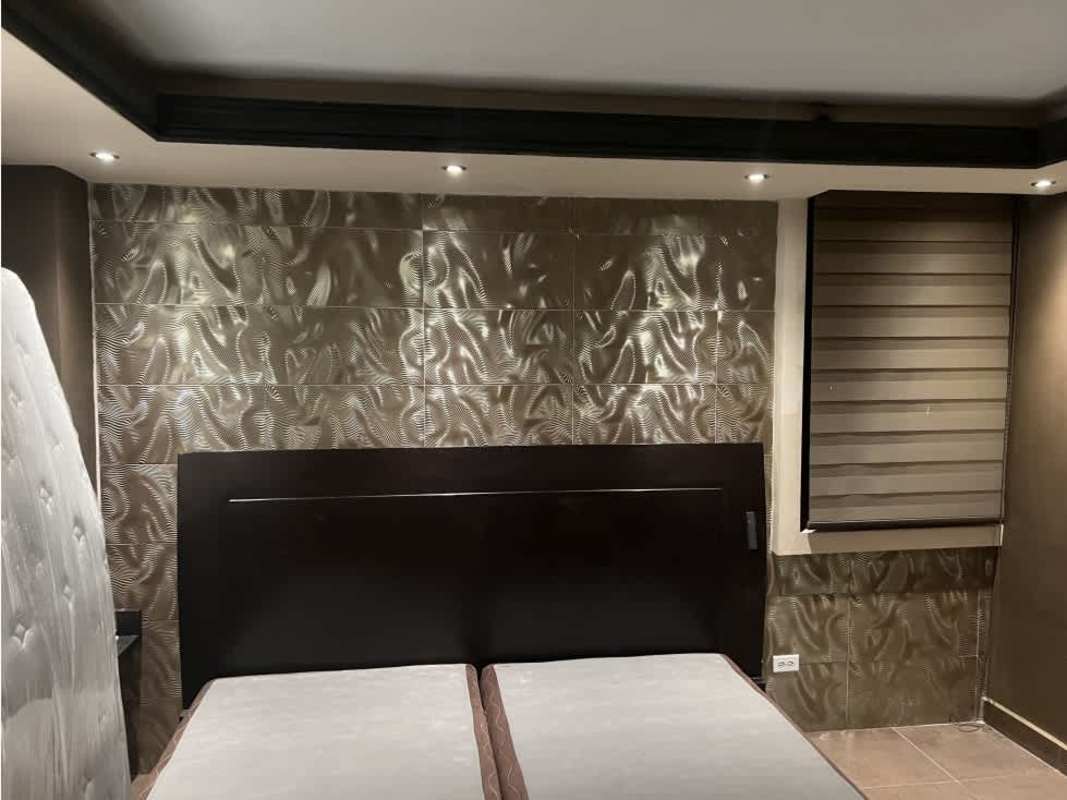 Modern bedroom with metallic textured wall, recessed lighting PH Cibeles El Dorado Panama