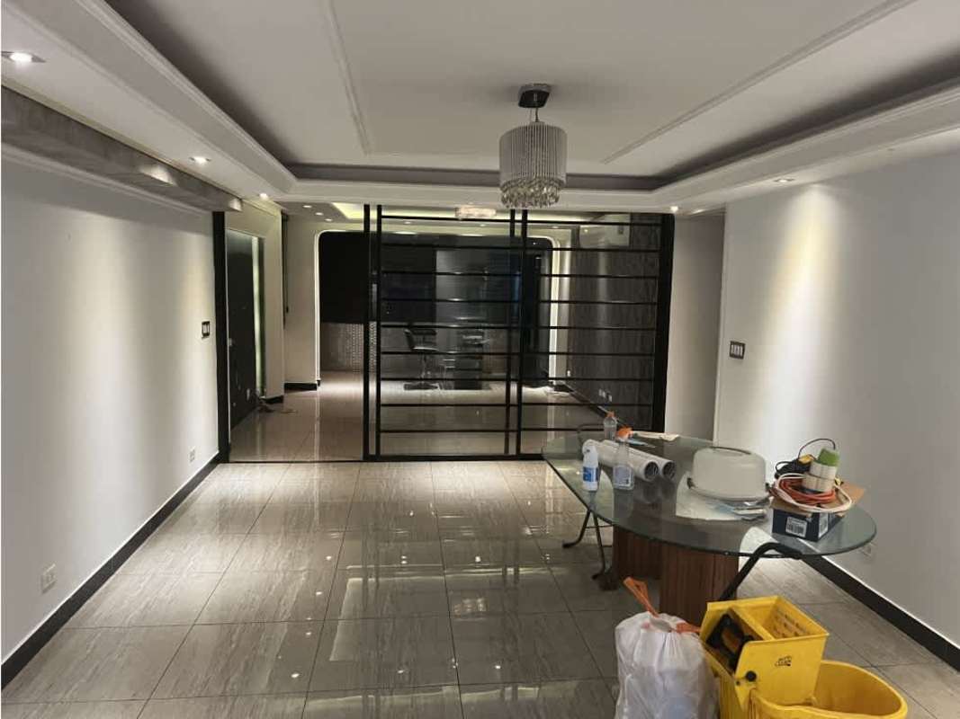 Kitchen with granite surfaces, dark wood cabinets, toaster oven in PH Cibeles El Dorado Panama City