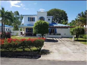 Ample living space with sofas, entertainment, natural light, Playa Blanca home for sale