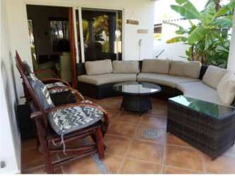 Bright stairs with arched window, ocean light, Playa Blanca property in Panama