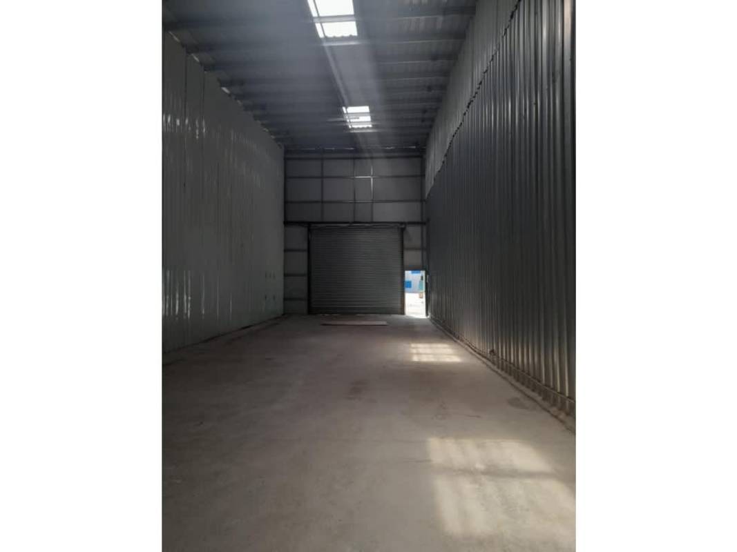 Spacious high-ceiling industrial warehouse interior with small office structure in Mañanitas Tocumen Panama
