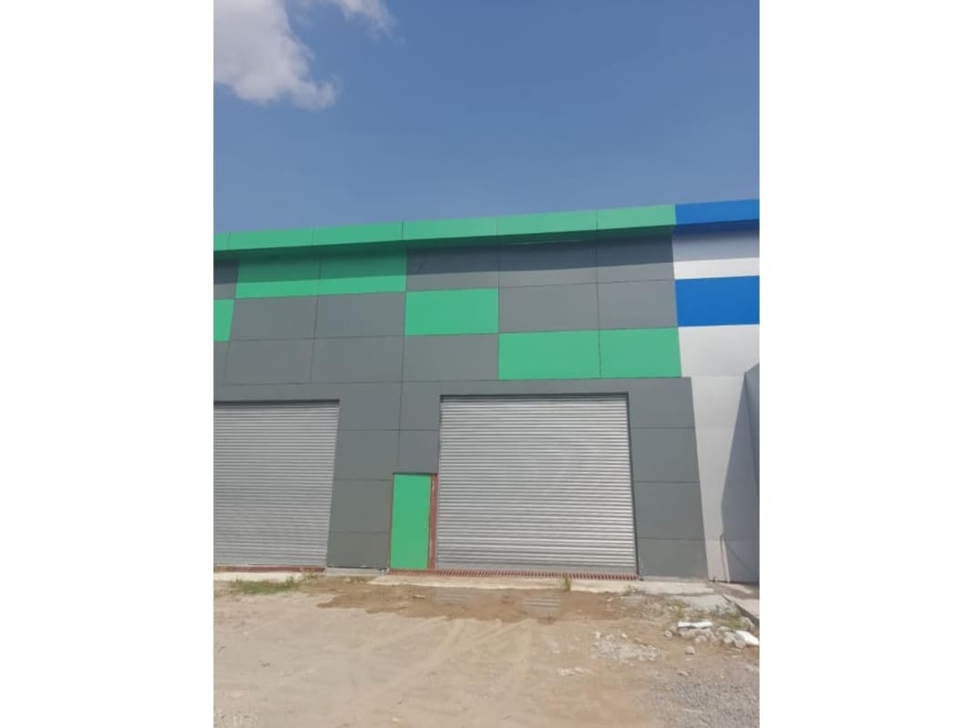Entrance and rolling shutter doors of industrial warehouse complex Mañanitas Tocumen Panama City