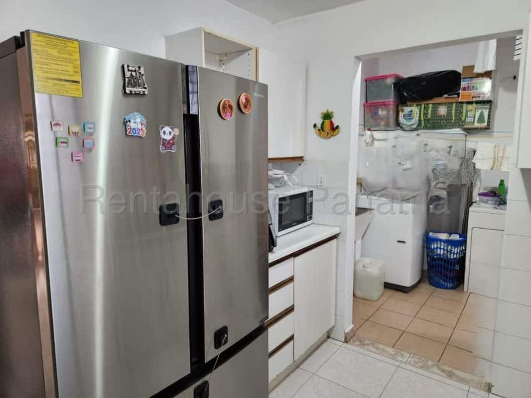 Bedroom with built-in closet and tiled floors in house for sale in Brisas del Golf Panama