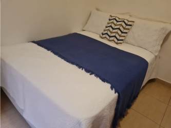 Bright colorful open plan living and dining room in Punta Chame beach house Panama