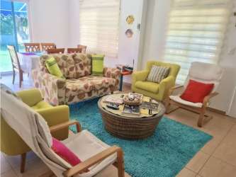 Colorful living room with tropical decor open plan Punta Chame beach house for sale
