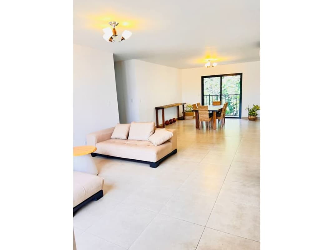 Open plan living dining room with balcony Embassy Village Albrook Panama apartment