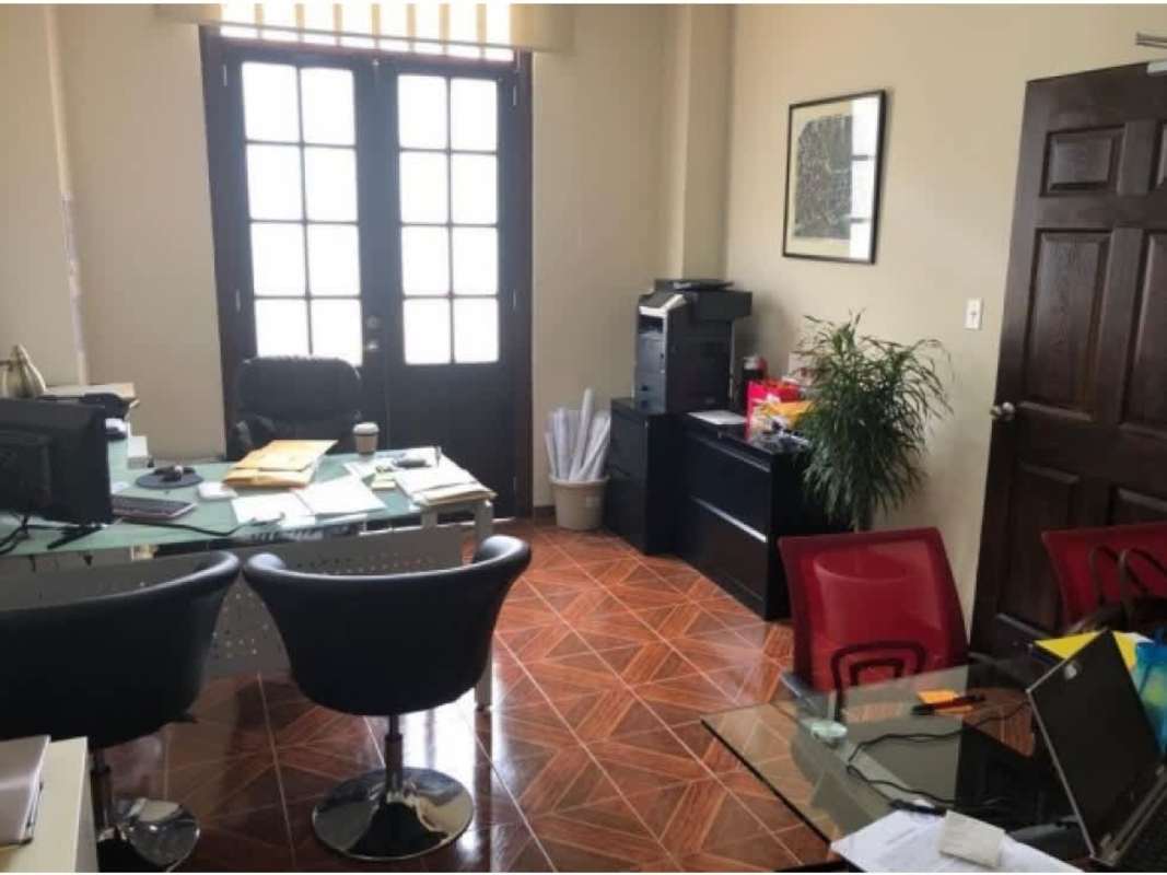 Contemporary office interior with french doors and glass desks at Casa Catalina Casco Viejo