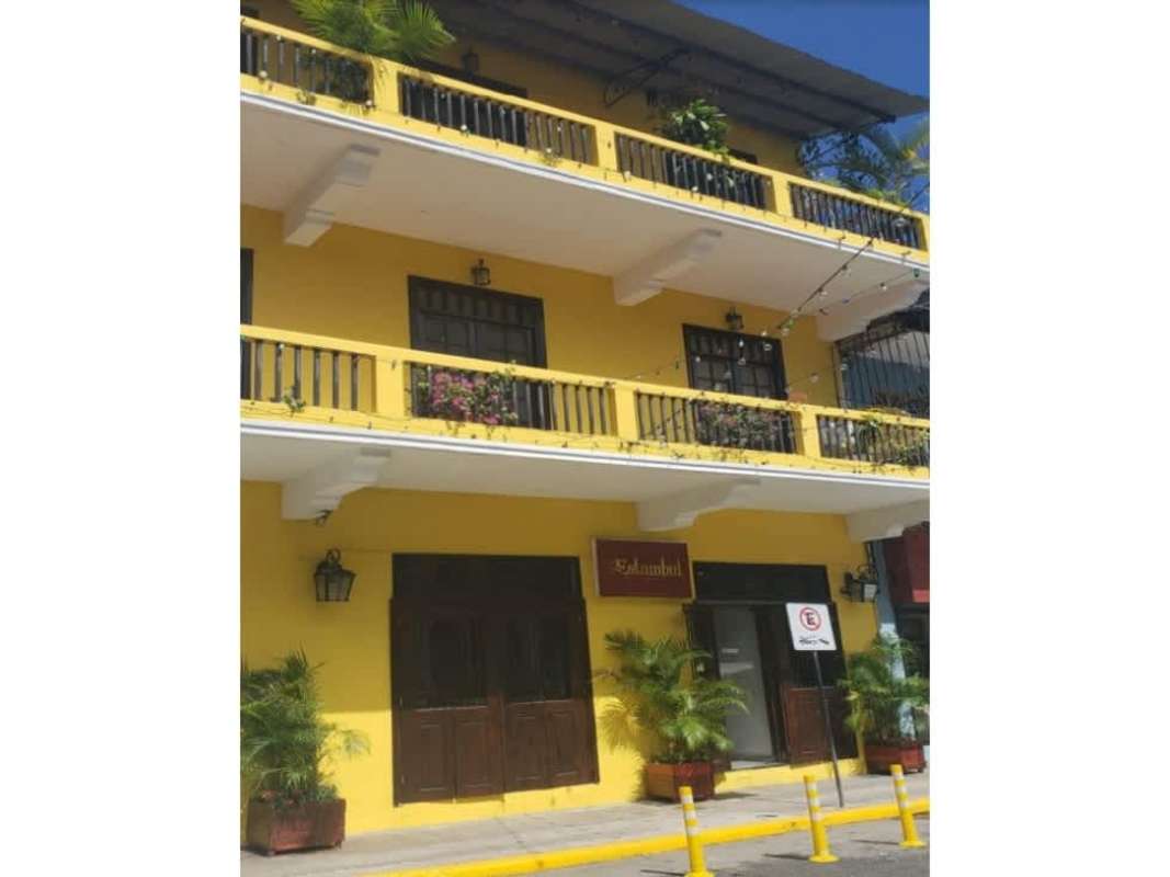 Bright office area with desks and large windows in Casa Catalina Casco Viejo Panama