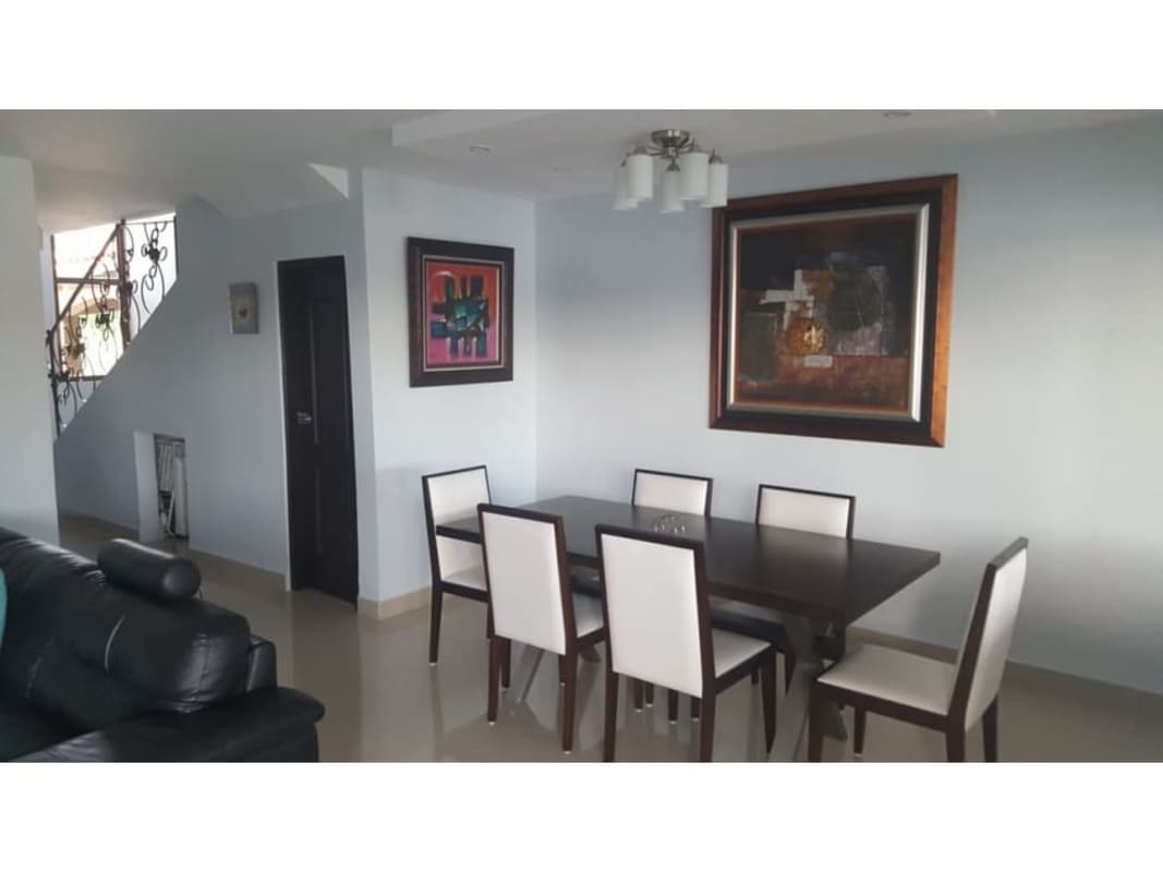 Bright master bedroom with large windows, closet and seating in townhouse at PH Green Village Las Cumbres