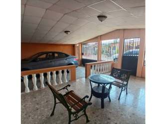 Multi-functional covered patio space with seating area in Altos de San Gabriel Arraijan Panama house