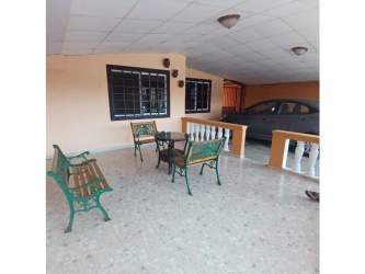 Interior hallway with natural light and security gate inside house at Altos de San Gabriel Nuevo Arraijan Panama