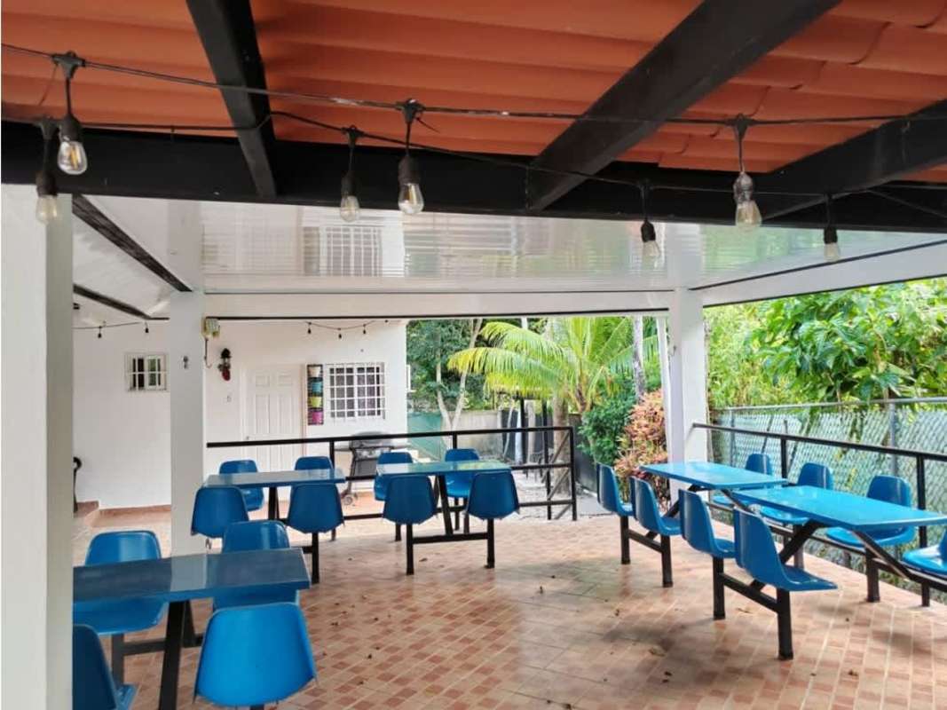Garden view with covered outdoor dining area Anton beach property for sale