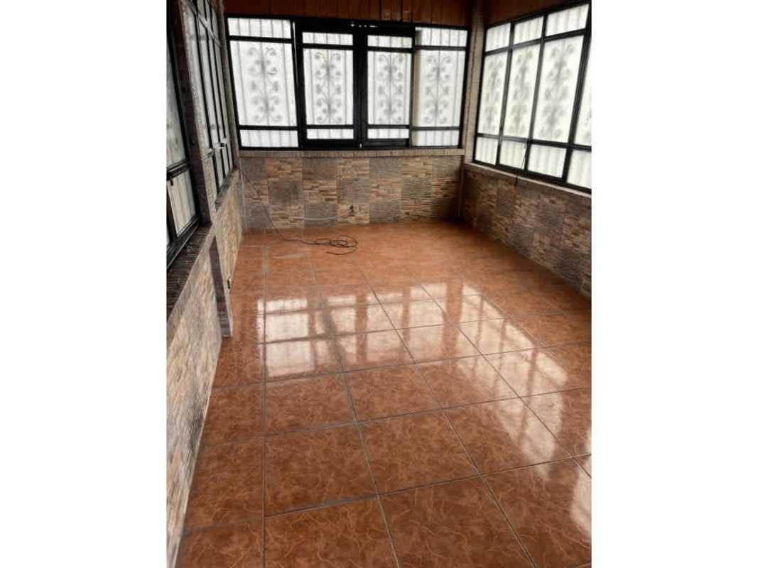 Rustic kitchen wood ceiling black tile countertops double sink natural light Cerro Viento Panama