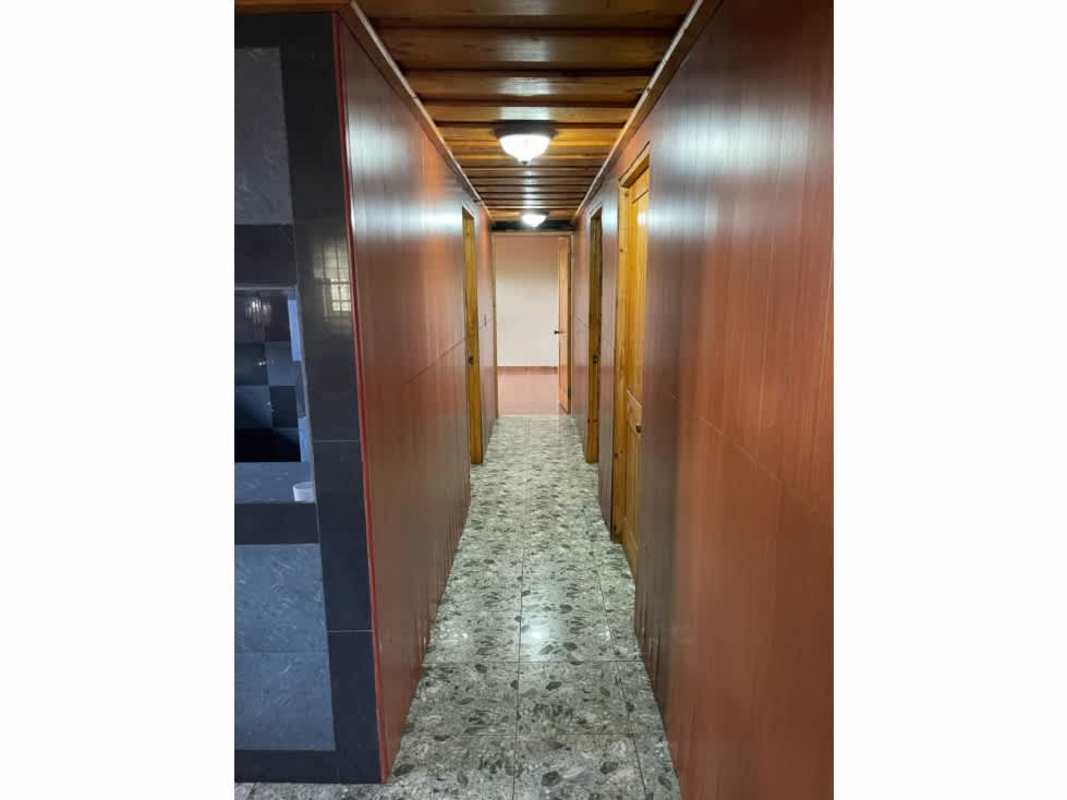 Bathroom with vessel sink granite counter stone textured tiles sliding shower door Cerro Viento