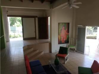 Living room with high ceilings, open layout, tiled floors in Playa Corona San Carlos Panama beach residence