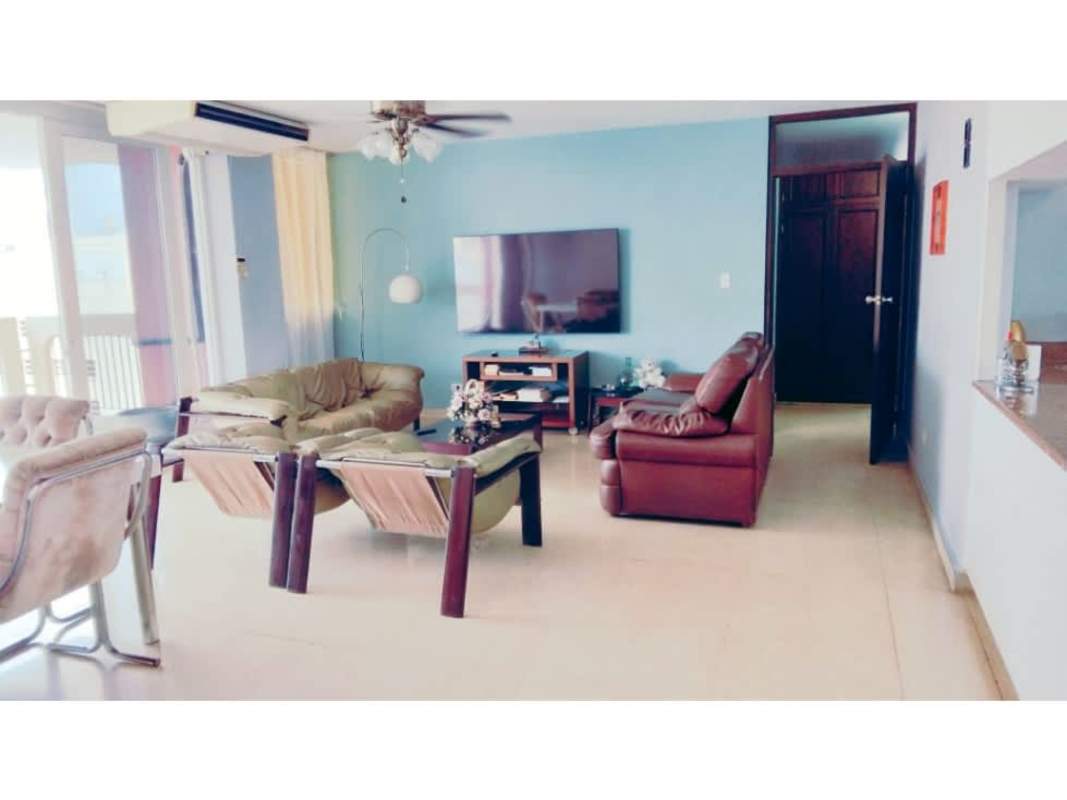 Living room with sliding glass balcony doors, ceiling fan, tile floor in PH Elege Panama City