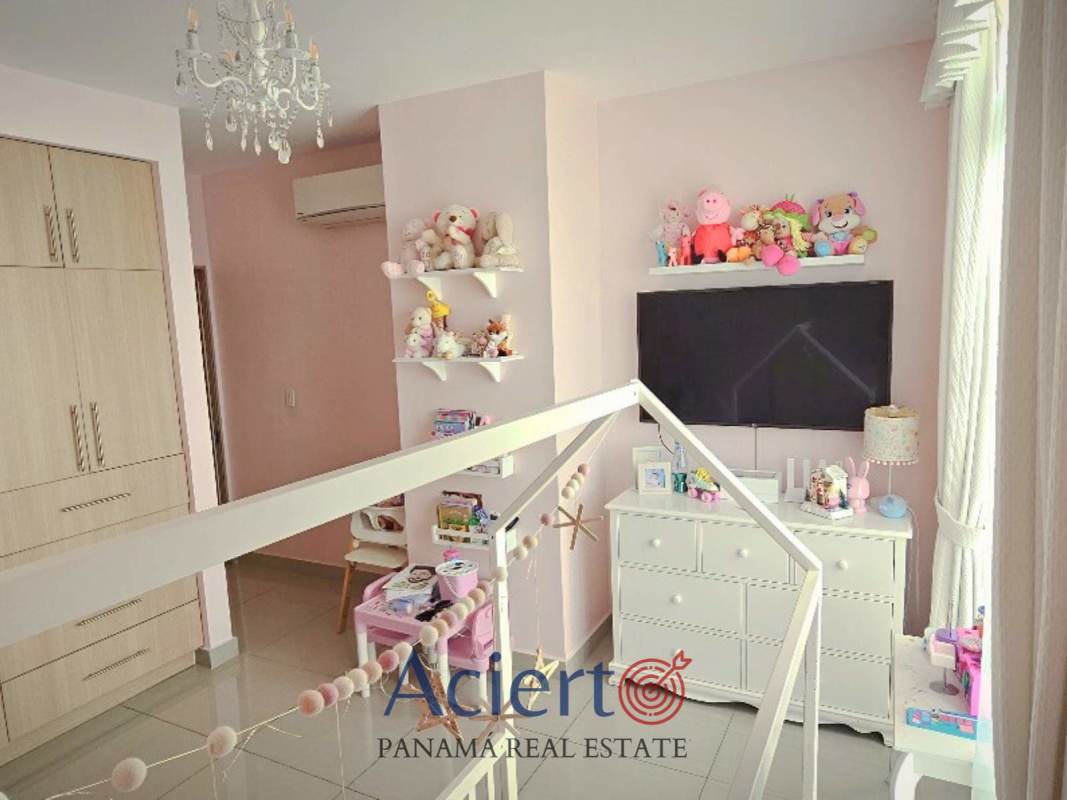 Bedroom with large window city skyline view at PH Coral Tower apartment San Francisco Panama