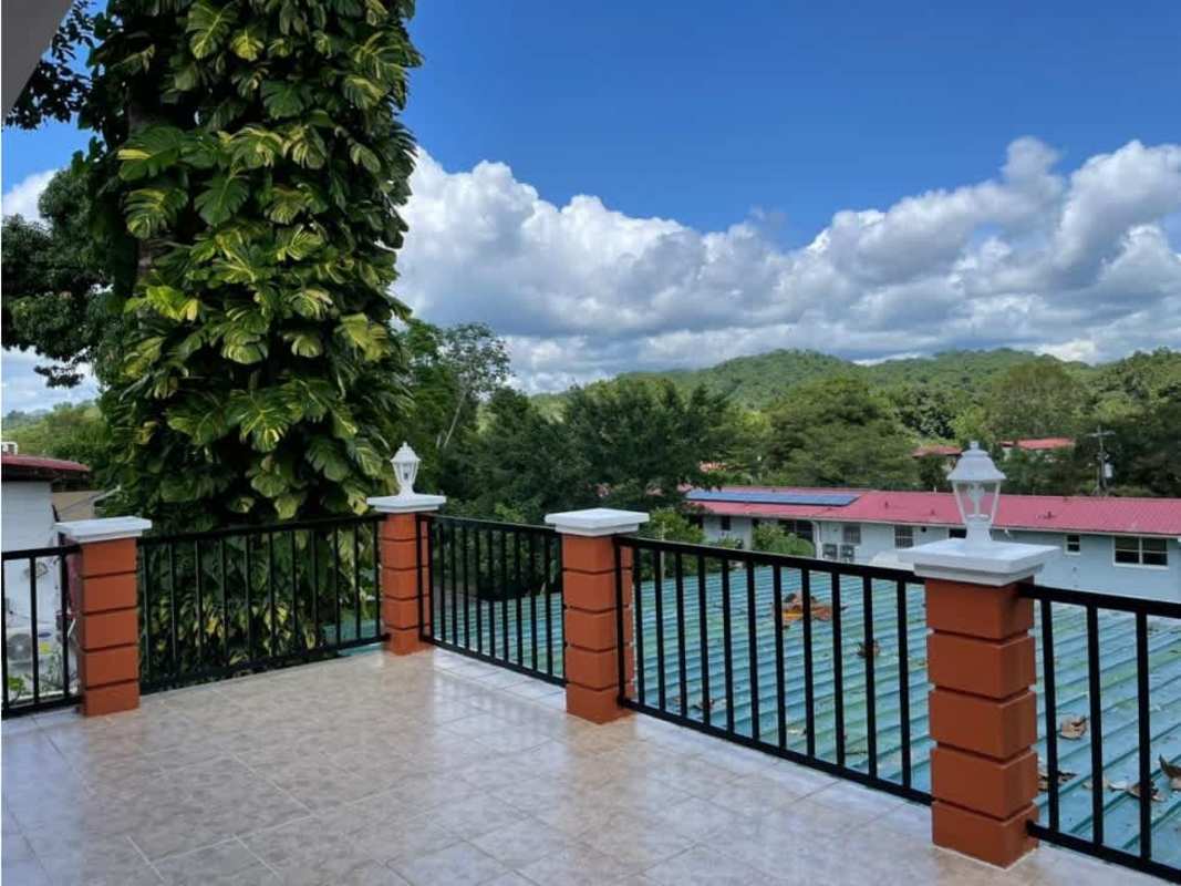 Kitchen with granite countertops wooden cabinetry natural light at Embassy Village Clayton Panama