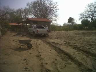 Palm-thatched shelter with ocean view on sandy beachfront land in Pocri Panama