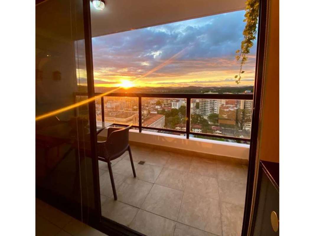 Elegant bathroom with glass shower, beige tiles, vanity sink in luxury condo PH Balboa Bay Panama