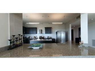Open modern kitchen with granite countertops and imported finishes in PH Las Olas Vista Mar Panama