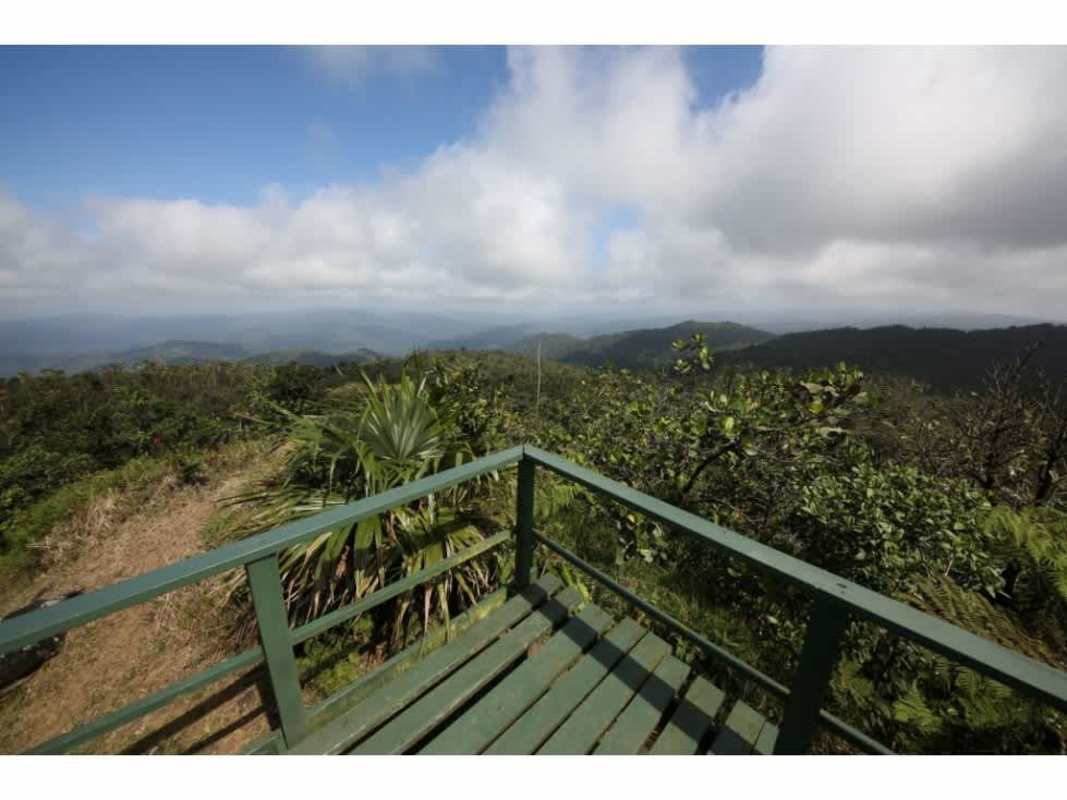 On-site operational restaurant with outdoor seating and surrounding mountain landscape