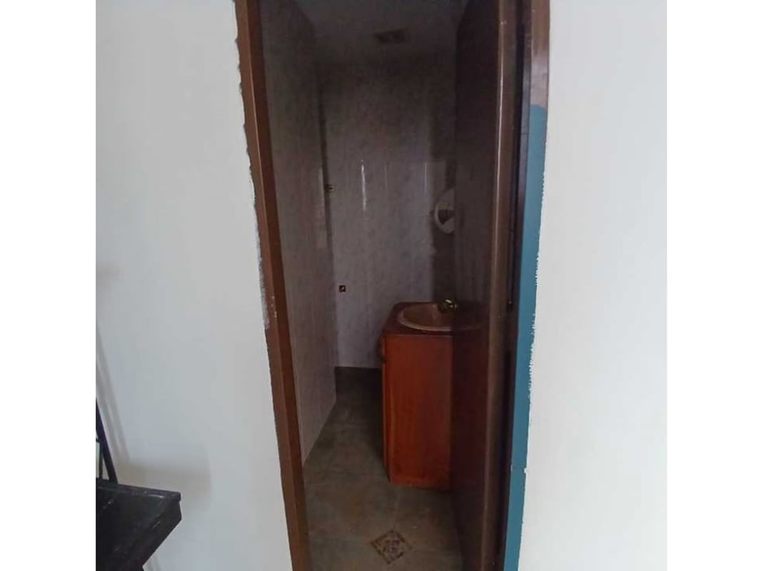 Private tiled bathroom with sink and toilet inside commercial unit San Francisco Panama