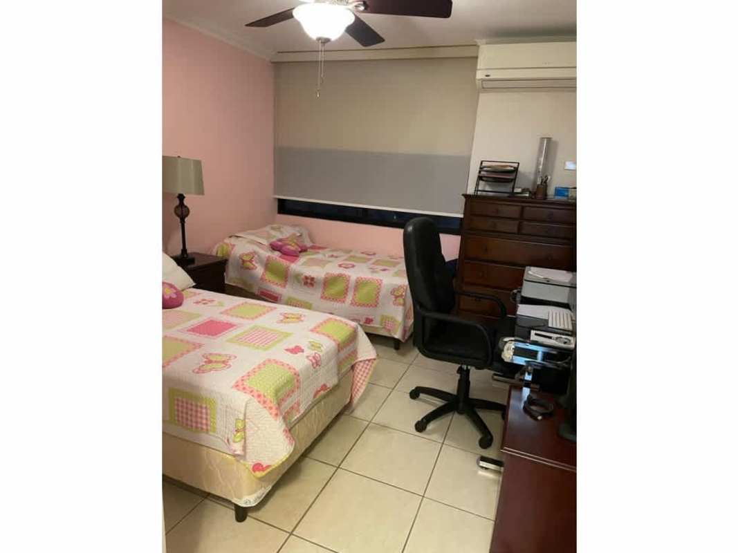 Bedroom with built-in closet and window natural light in PH Coco Mar