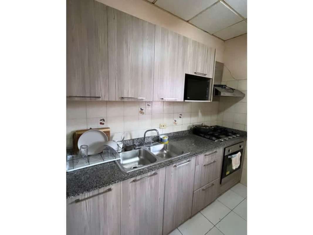 Modern kitchen with granite counters, gas stove, oven in Villa Zaita Panama house