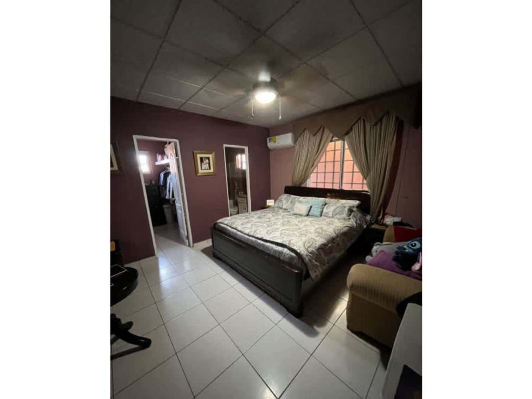 Colorful children's bedroom with two beds, ceiling fan, AC, wall TV in Villa Zaita Panama