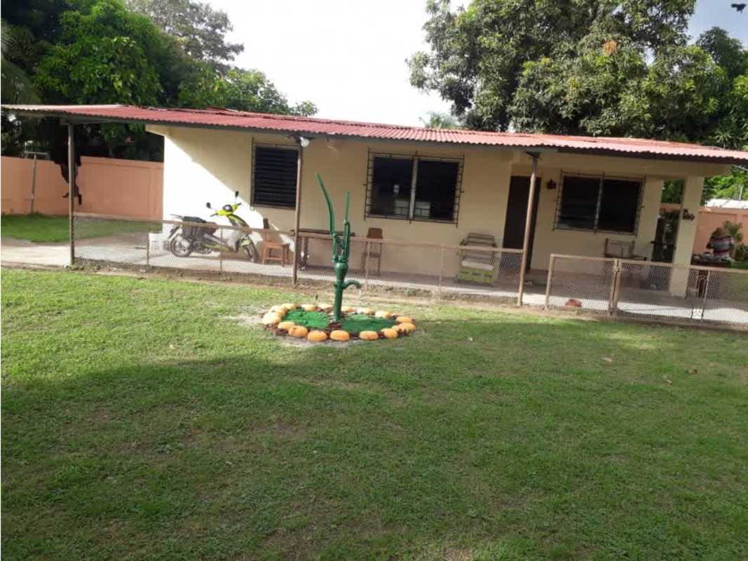 Street view of fenced corner property with front porch at Ciudad Radial commercial zone