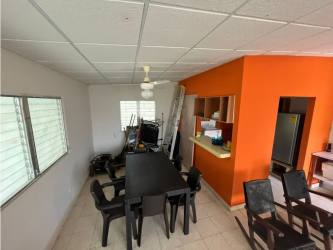 Living and dining room with ample light for sale beach house Coronado Panama